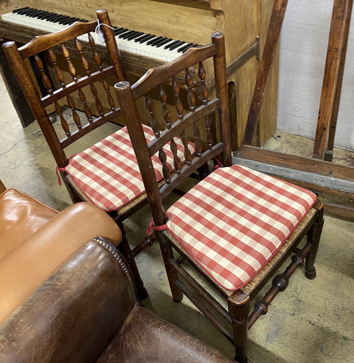 A set of eight Lancashire rush seat spindle back dining chairs, and one other